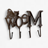 Whimsical cast iron cat wall rack with textured finish and four functional hooks