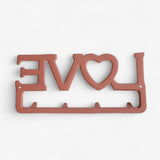 Cast iron LOVE wall organizer with heart cutout and four hooks in warm rust finish