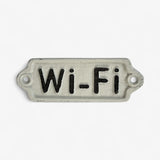 Cream enamel Wi-Fi plaque with black text showing mounting holes and aged metal patina