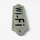Cast iron Wi-Fi decorative sign with raised text and distressed cream-colored enamel finish