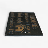 Cast iron wall sign close-up showing gold embossed text, angled product view