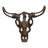 Cast iron bull skull wall accent with textured bronze surface and three-dimensional horns