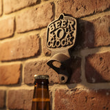 Black cast iron beer o clock bottle opener mounted on brick wall with bottle