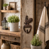 Rooster cast iron wall hook hanging on a rustic beam.