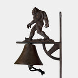 Sasquatch cast iron porch bell with detailed sculptural form and traditional bracket hardware