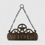 Cast iron welcome plaque close-up, bronze star detail, weathered finish