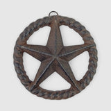 Weathered charcoal cast iron roped star ornament with rustic patina finish