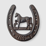 Western decor horseshoe with horse and welcome text, rough textured cast iron, dark weathered finish