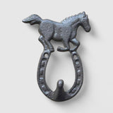 Close-up of textured cast iron horse sculpture showing detailed metal finish