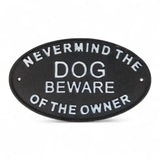 Beware of Owner cast iron plaque mounted on blue-green wooden gate, black finish