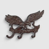Antique bronze cast iron double eagle wall hook with weathered patina and decorative talon feet