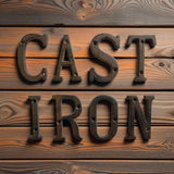 Weathered cast iron CAST IRON letters on rustic wood plank, dark patina finish