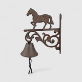 Cast iron horse bell isolated, dark bronze finish with decorative mounting bracket