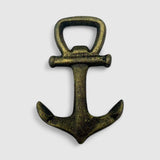 Vintage bronze cast iron anchor opener, close-up detail of cross-shaped handle design