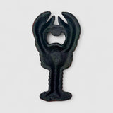 Rustic cast iron bottle opener shaped like lobster with worn vintage finish detail