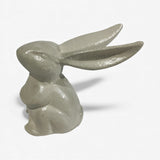 Cream cast iron bunny figure at angle featuring elongated ears and smooth polished ceramic-like finish