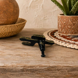 Back view of cactus cabinet knob with mounting screw on a wooden tabletop