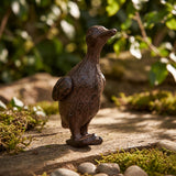 Bronze-brown cast iron standing duck garden figurine among moss and stones, SKU GB78061