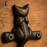 Side view of antique bronze cat wall hook with single curved hook, SKU GB78065