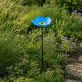 Blue cast iron flower bird feeder and bath on a garden stake.