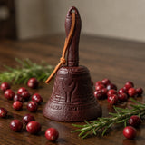 Burgundy cast iron hand dinner bell with leather strap and holiday styling, SKU GB78097