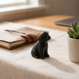Side view of black cast iron puppy paperweight with floppy ears, SKU GB78103