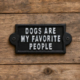 Black cast iron wall sign with white Dogs Are My Favorite People lettering.