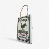 Vintage-style metal farm house welcome sign with rooster, side view showing depth and white enamel