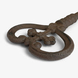 Three cast iron antique keys with ornate rings, rustic brown patina decor