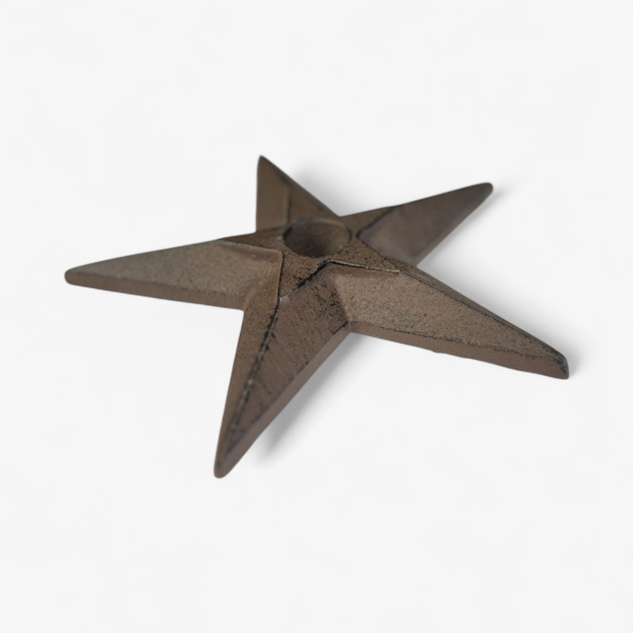 Rustic cast iron star accent, flat 3D profile showing dimensional points, weathered bronze patina