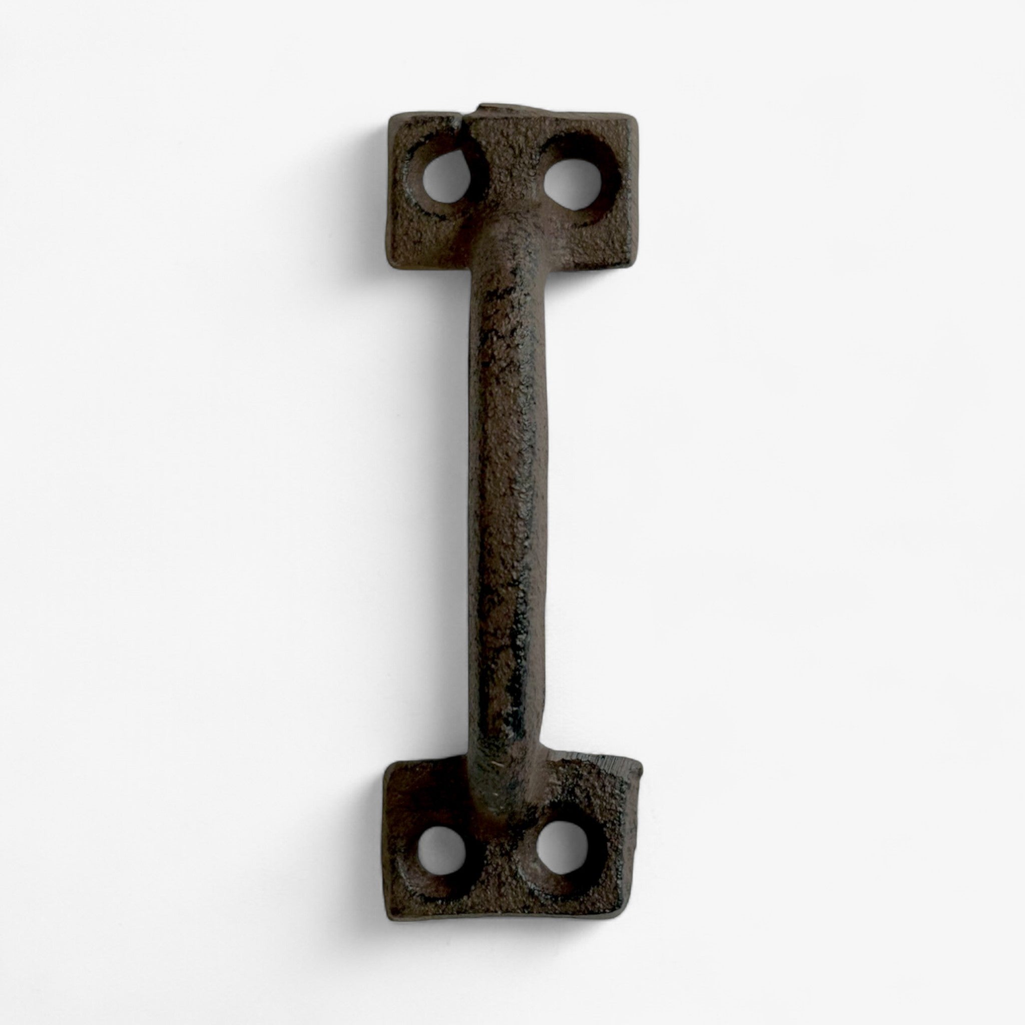 Industrial cast iron T-shaped pull with mounting holes and weathered dark brown finish