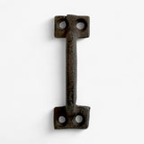 Industrial cast iron T-shaped pull with mounting holes and weathered dark brown finish