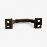 Heavy-duty cast iron drawer pull with curved arch design and worn dark finish