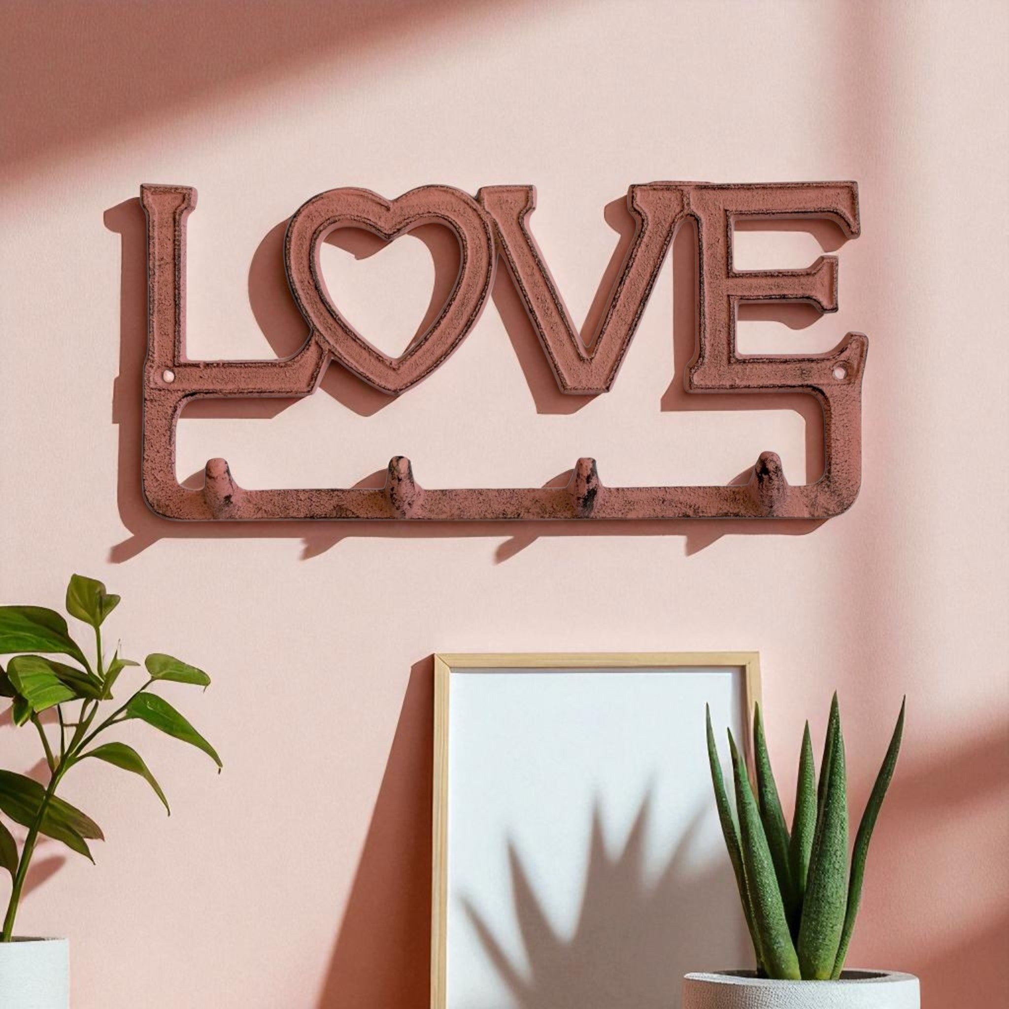 Cast iron LOVE heart hook rack with four hanging hooks and rust-brown vintage finish