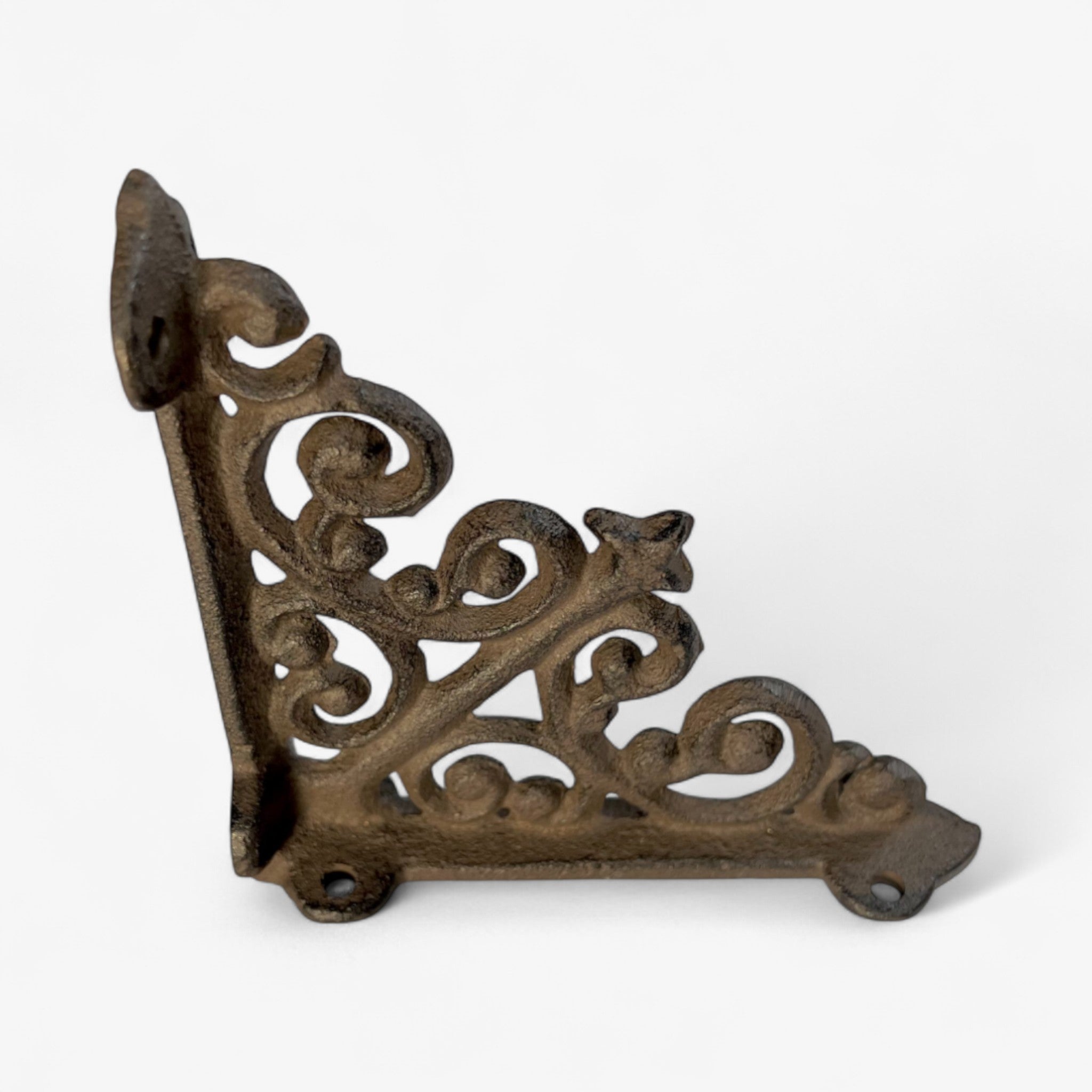 Cast iron scroll bracket with decorative swirls, side view showing dimensional relief