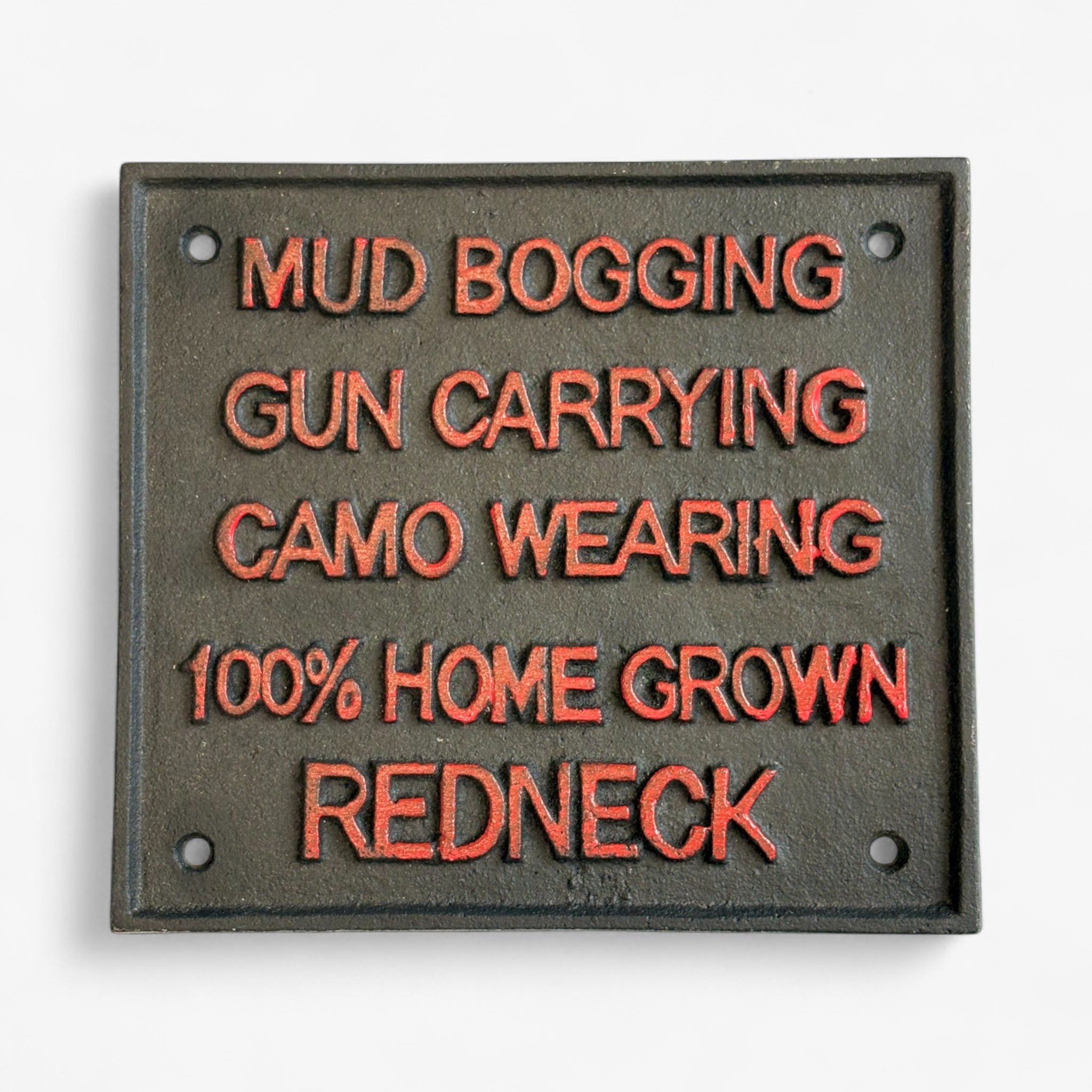 Redneck Pride cast iron plaque closeup, orange raised text, green-gray finish, humorous sign