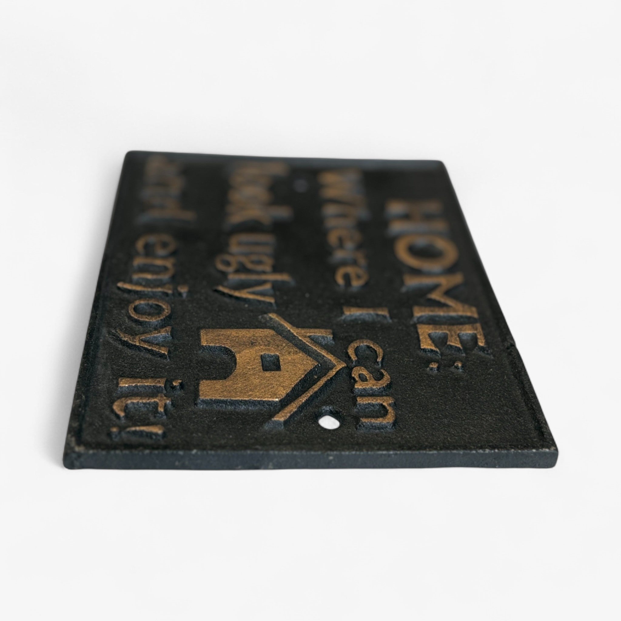 Cast iron wall sign close-up showing gold embossed text, angled product view