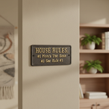 House Rules cast iron plaque wall decor with vintage bronze finish, mounted indoors