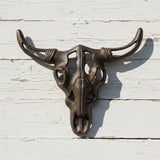 Bronze cast iron bull skull wall decor with ornate details and weathered patina finish