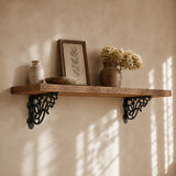 Styled wall shelf with black cast iron decorative brackets and farmhouse decor
