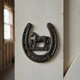 Cast iron horseshoe welcome sign, horse motif, dark patina finish with cutout horse head detail