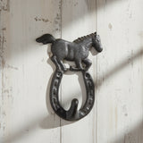 Cast iron horseshoe hook with horse figurine topper, black farmhouse wall decor