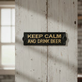 Black cast iron Keep Calm And Drink Beer pub sign, textured finish gold lettering