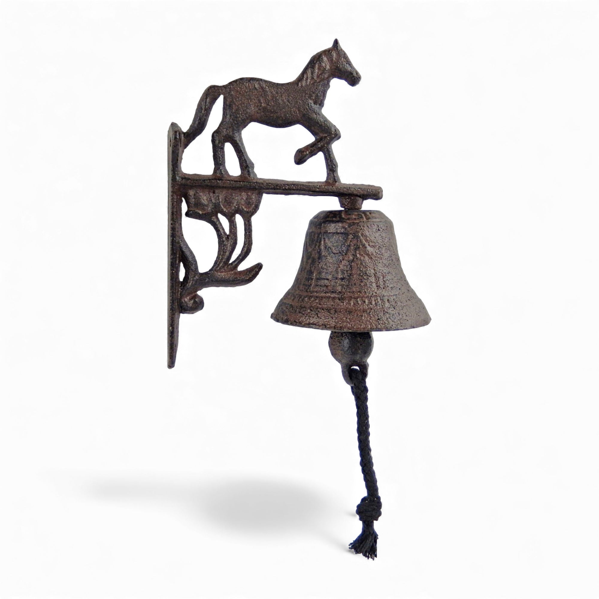 Vintage cast iron horse wall bell showing running pony silhouette detail, oxidized finish