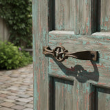 Cast iron star handle cabinet pull with dark patina, curved design with mounting holes, western style