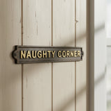 Cast iron naughty corner plaque amusing wall sign dark brown brushed finish