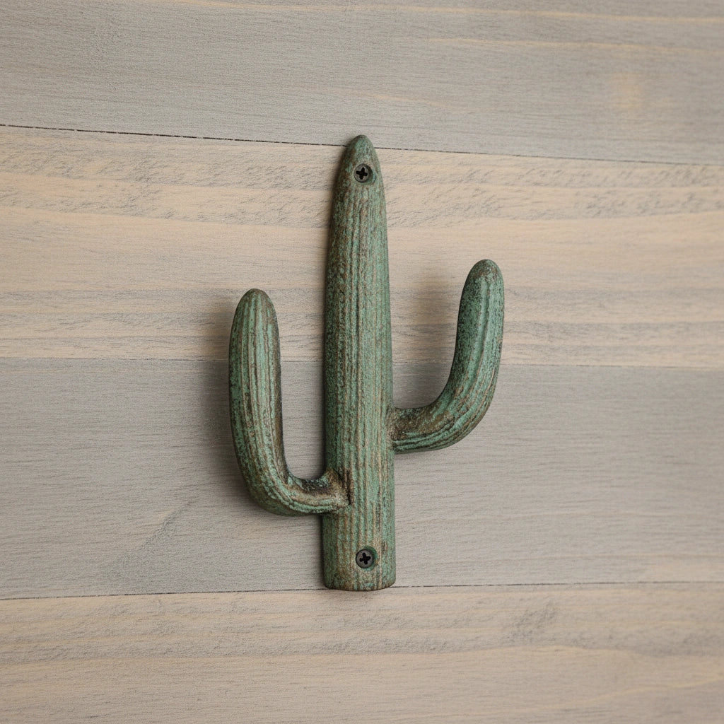 Verdigris cast iron cactus hook with textured finish and dual mounting points for southwest decor