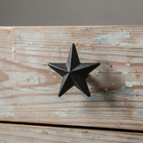 Cast iron star knob with dark patina, dimensional 3D form showing mounting screw and rustic texture
