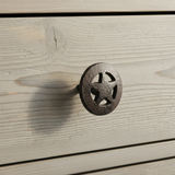 Cast iron circle star knob drawer pull with cut-out star design and black threaded bolt, textured rustic finish