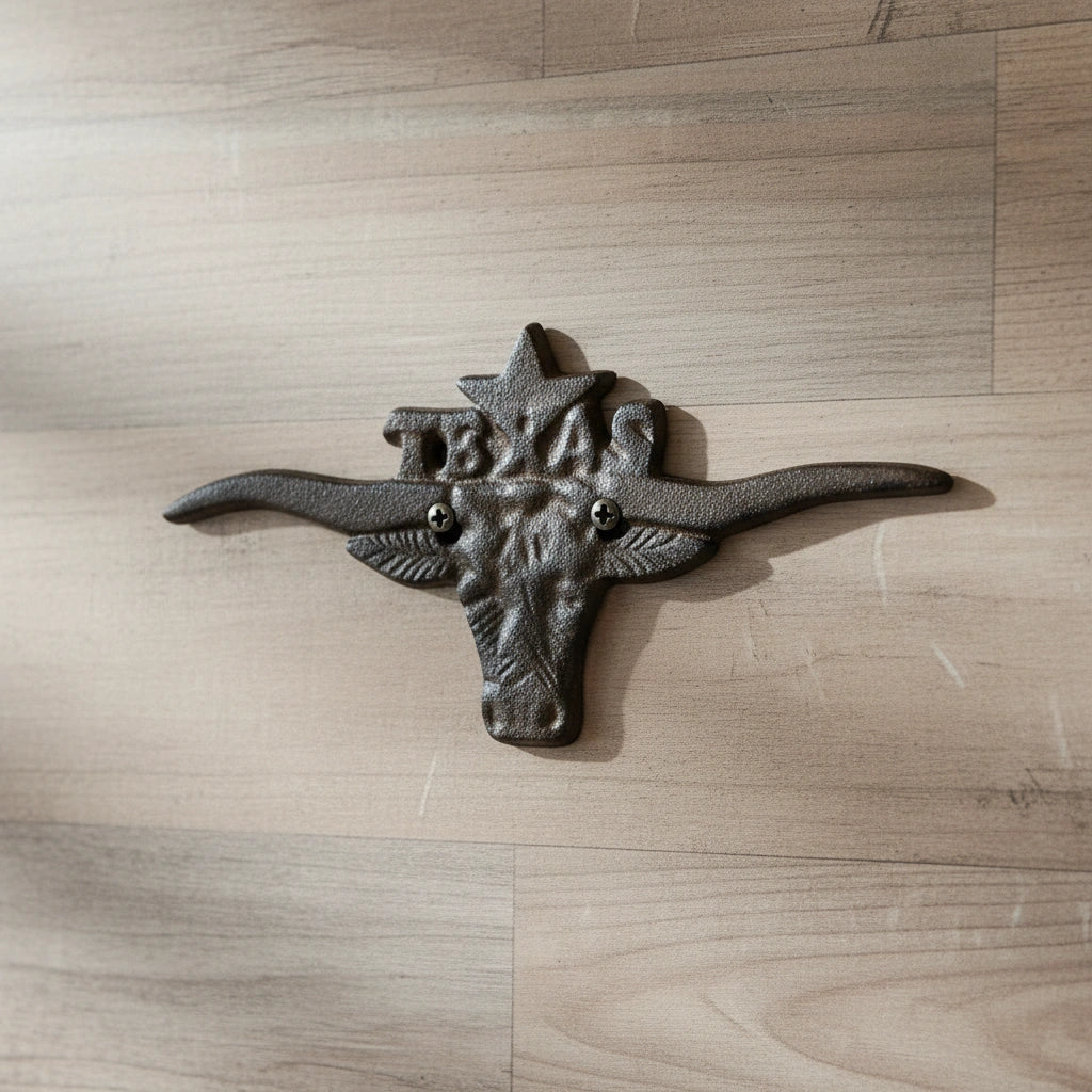 Black cast iron Texas longhorn wall decor with wide horns, rustic ranch style accent
